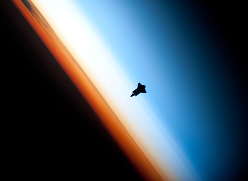 The Space Shuttle, Endeavour, Against Backdrop Of The Different Layers Of Earth